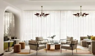 Lobby lounge and workspace at Kimpton Theta New York - Times Square.