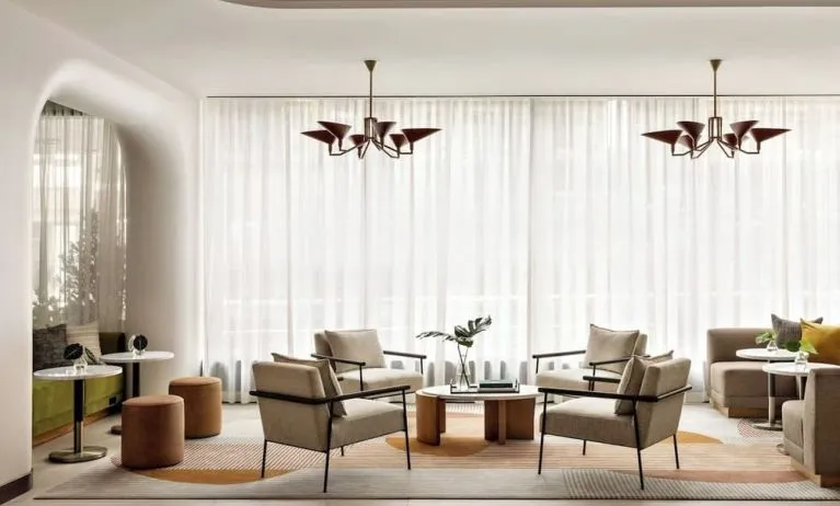 Lobby lounge and workspace at Kimpton Theta New York - Times Square.