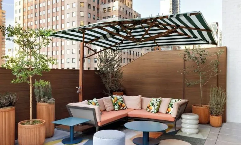 Terrace lounge seating at Kimpton Theta New York - Times Square.