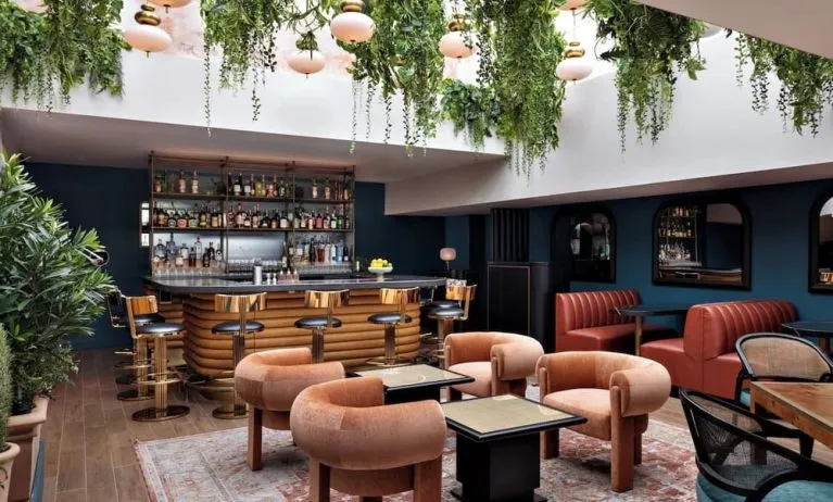 On-site bar with lounge seating at Kimpton Theta New York - Times Square.