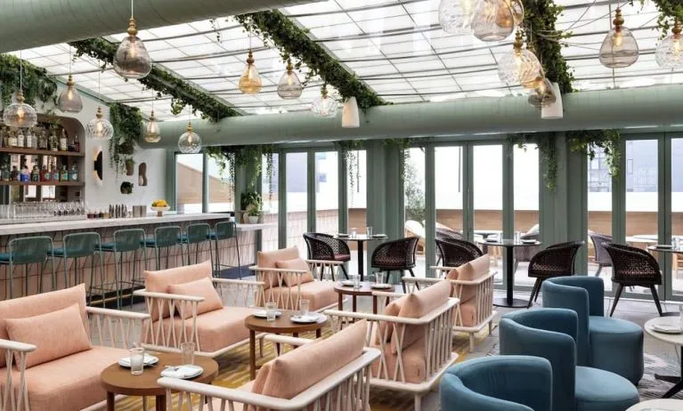 On-site restaurant with comfortable seating at Kimpton Theta New York - Times Square.