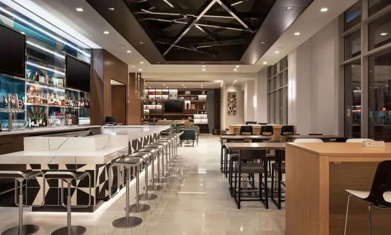 Hotel bar with lounge area perfect for coworking at Tru By Hilton Denver Downtown Convention Center.