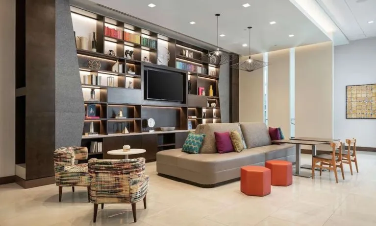 Lobby lounge and workspace at Tru By Hilton Denver Downtown Convention Center.