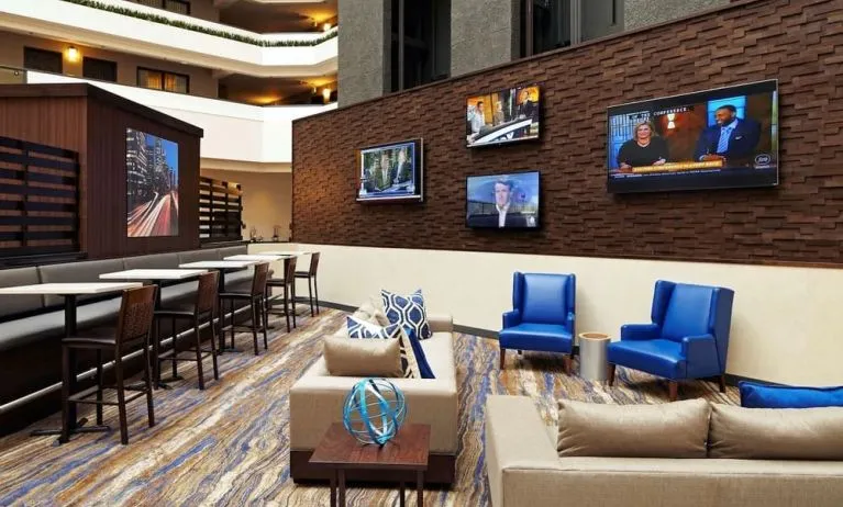 Lobby lounge and workspace at Embassy Suites By Hilton Los Angeles-Intl Airport North.
