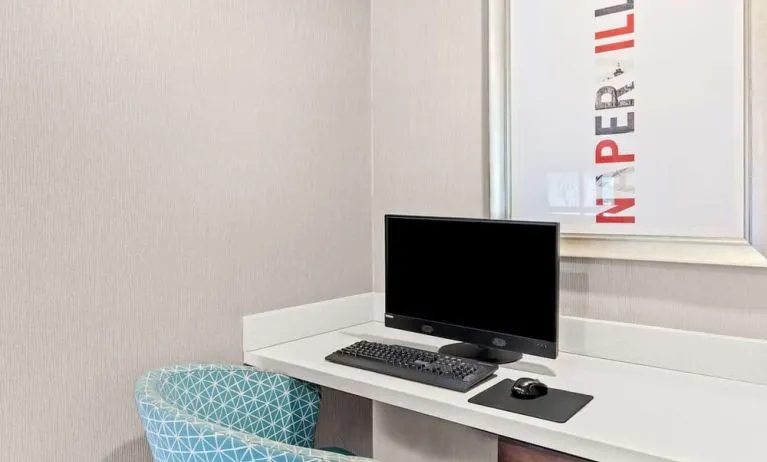 Business center with computer, printer and comfortable seating at Hampton Inn Chicago/Naperville.