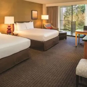Queen room with TV at DoubleTree By Hilton Seattle Airport.