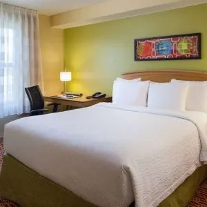 Day use room with king bed and work desk at Sonesta Simply Suites Phoenix Scottsdale.