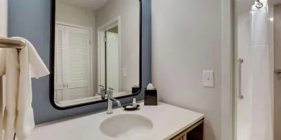 Private guest bathroom with shower and free toiletries at Sonesta Select Scottsdale At Mayo Clinic Campus.