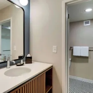 Private guest bathroom with shower and free toiletries at Sonesta Select Scottsdale At Mayo Clinic Campus.
