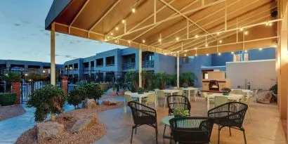 Hotel patio with comfortable seating and fireplace at Sonesta Select Scottsdale At Mayo Clinic Campus.