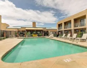 Relaxing outdoor pool with lounge chairs at Sonesta Select Scottsdale At Mayo Clinic Campus.