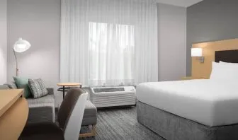 Day use room with sofa and work desk at TownePlace Suites Franklin Cool Springs.