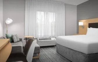 Day use room with sofa and work desk at TownePlace Suites Franklin Cool Springs.