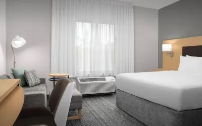 Day use room with sofa and work desk at TownePlace Suites Franklin Cool Springs.