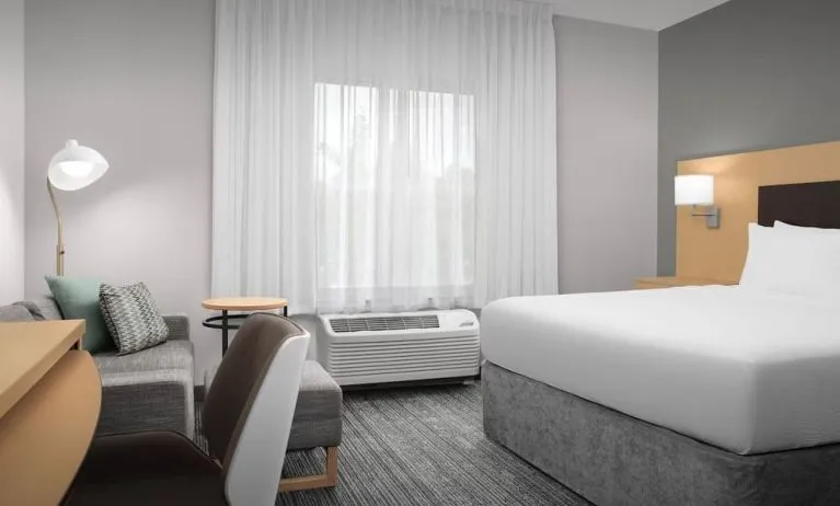 Day use room with sofa and work desk at TownePlace Suites Franklin Cool Springs.
