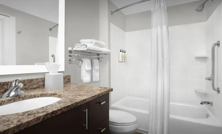 Guest bathroom with shower and tub at TownePlace Suites Franklin Cool Springs.