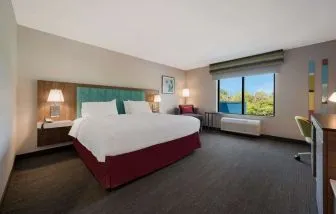 Spacious day use room with work desk at Hampton Inn Detroit Southfield.