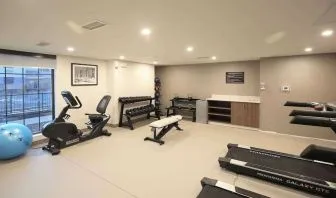 Well equipped fitness center at Sleep Inn Oakbrook Terrace.