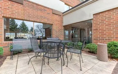 Outdoor terrace with seating at Holiday Inn Express Chicago - Downers Grove.