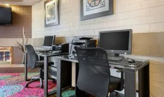 Business center with computers, printer and ergonomic chairs at Holiday Inn Express Chicago - Downers Grove.