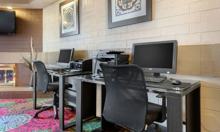 Business center with computers, printer and ergonomic chairs at Holiday Inn Express Chicago - Downers Grove.