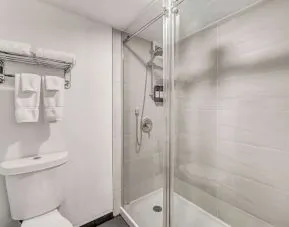 Private guest bathroom with shower at Radisson Hotel Schaumburg.