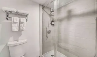 Private guest bathroom with shower at Radisson Hotel Schaumburg.