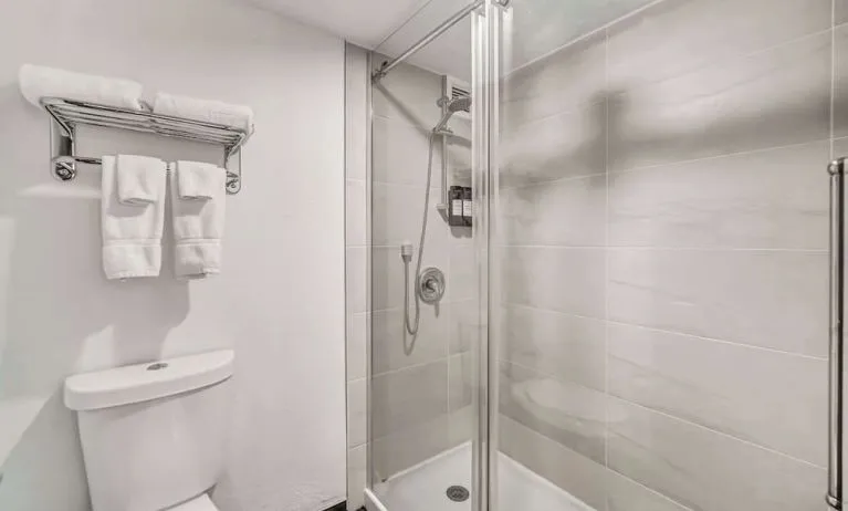 Private guest bathroom with shower at Radisson Hotel Schaumburg.