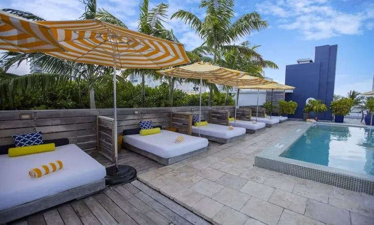 Outdoor pool with lounge beds at Catalina Hotel & Beach Club.