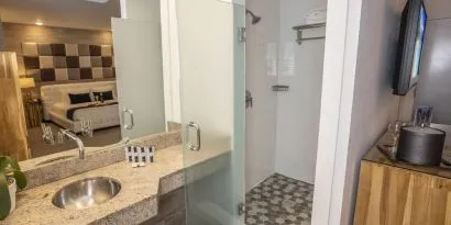 Private guest bathroom with shower and free toiletries at Catalina Hotel & Beach Club.