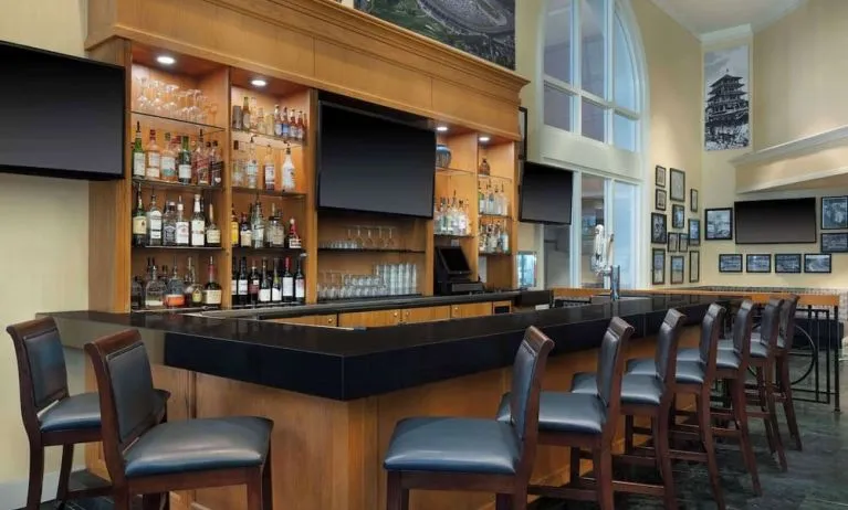 On-site bar and lounge area at Hilton Indianapolis Hotel & Suites.