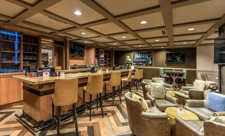 Dining area with lounge seating at Hilton Baton Rouge Capitol Center.