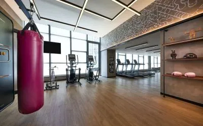 Fitness center with natural light at Moxy Boston Downtown.