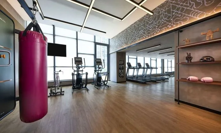 Fitness center with natural light at Moxy Boston Downtown.
