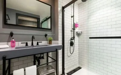 Private guest bathroom with shower at Moxy Boston Downtown.