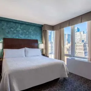 King bedroom with city views at Hilton Garden Inn New York/West 35th Street.
