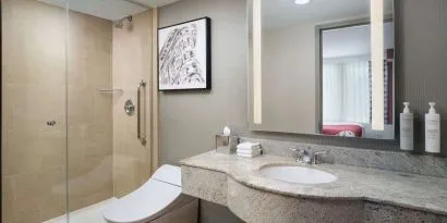 Private guest bathroom with shower at Hilton Garden Inn New York/West 35th Street.
