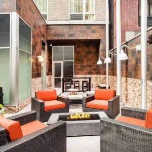 Cozy coworking space with fire pit at Hilton Garden Inn New York/West 35th Street.
