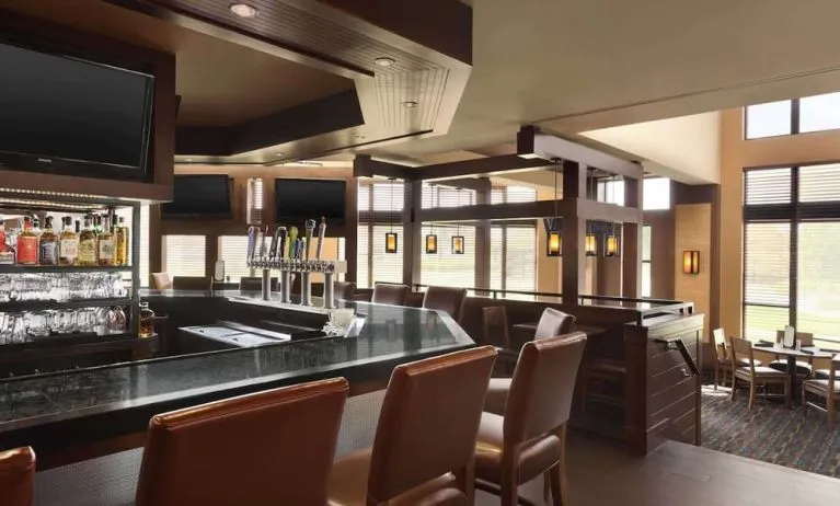 Hotel bar with lounge seating at DoubleTree By Hilton Hartford - Bradley Airport.