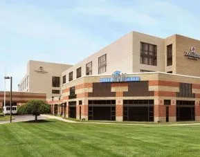 Hotel exterior and parking area at DoubleTree By Hilton Hartford - Bradley Airport.