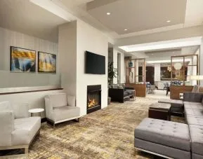 Lobby lounge area with fireplace at DoubleTree By Hilton Hartford - Bradley Airport.