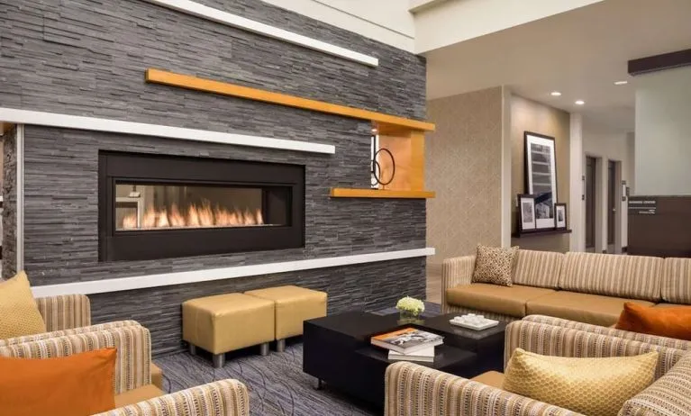 Lobby lounge with fireplace at Hampton Inn & Suites Rosemont Chicago O'Hare..