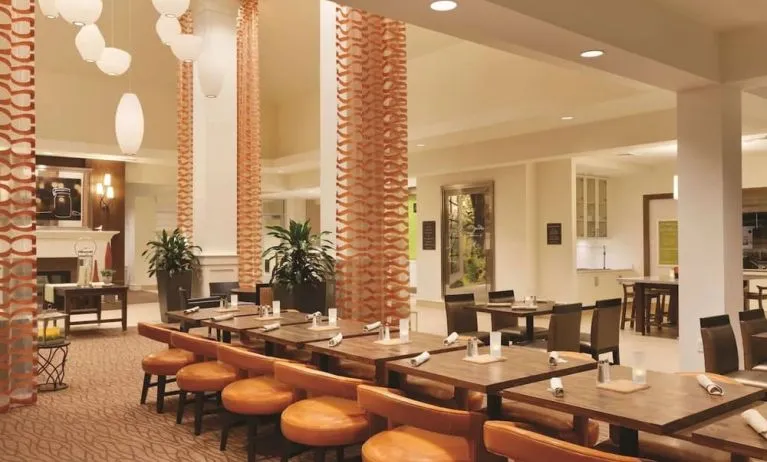 Dining area perfect for coworking at Hilton Garden Inn Boston Logan Airport.