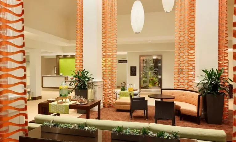 Lobby and coworking lounge at Hilton Garden Inn Boston Logan Airport.