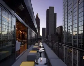 Hotel bar with balcony at Royalton Park Avenue.