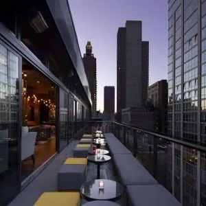 Hotel bar with balcony at Royalton Park Avenue.