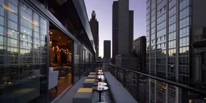 Hotel bar with balcony at Royalton Park Avenue.