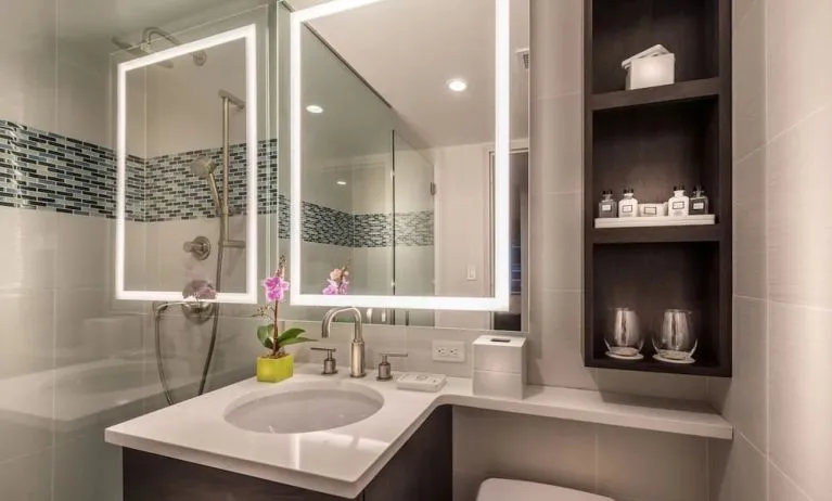 Guest bathroom with shower at The Bernic Hotel New York City, Tapestry Collection By Hilton.