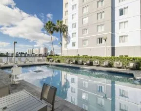 Stunning outdoor pool at Homewood Suites By Hilton Miami Airport-Blue Lagoon.