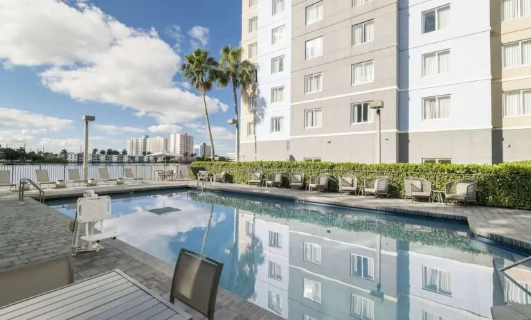 Stunning outdoor pool at Homewood Suites By Hilton Miami Airport-Blue Lagoon.